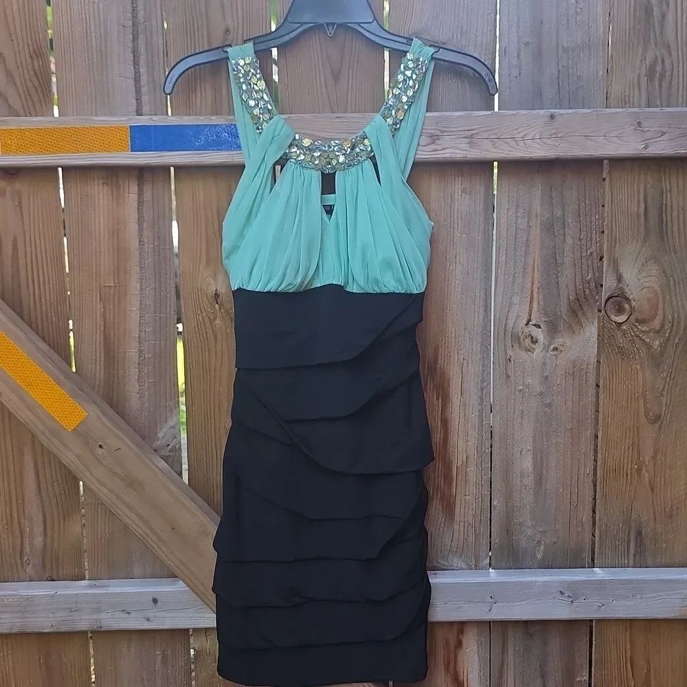 Elegant Black and Mint Dress with Embellished Neckline